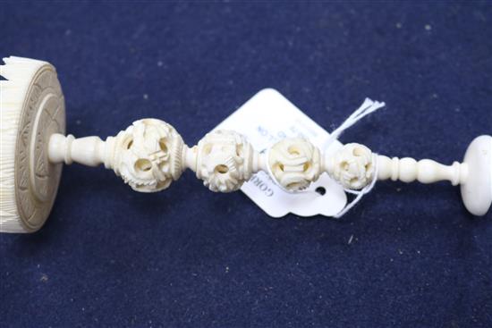 A Chinese carved ivory ball on stand